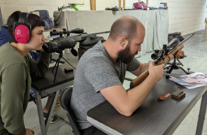 Historic rifle display with expert safety instruction